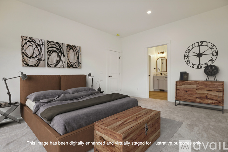 A bedroom with a large bed and a wooden coffee table.