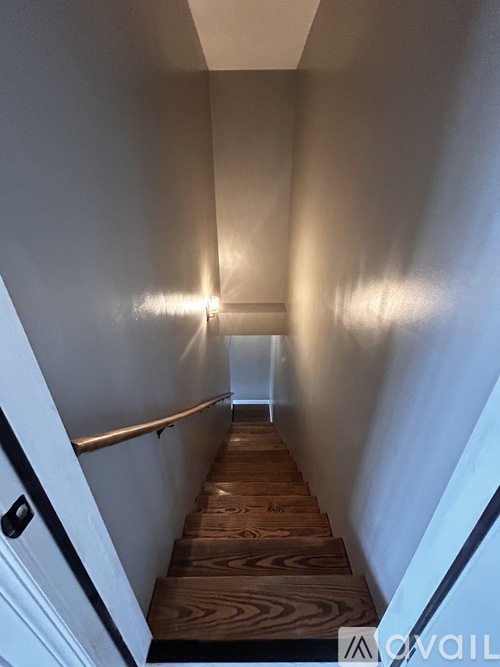A long hallway with a light at the end.