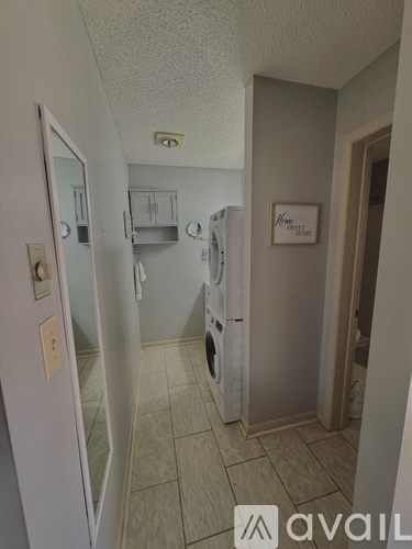 A small room with a washer and dryer.
