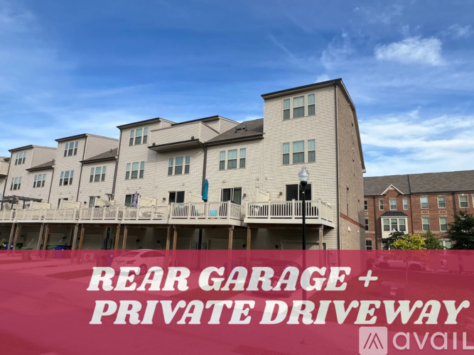 A building with a sign that says "REAR GARAGE + PRIVATE DRIVEWAY AVAIL".