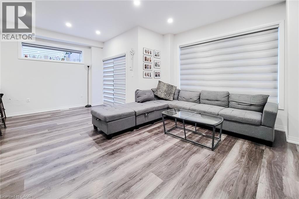 A living room with a grey sofa and a coffee table.