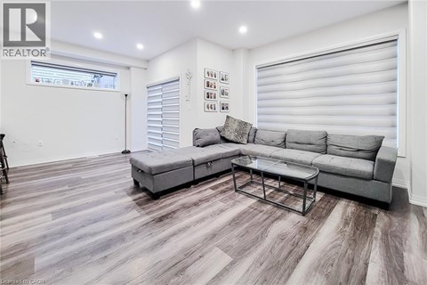 A living room with a grey sofa and a coffee table.