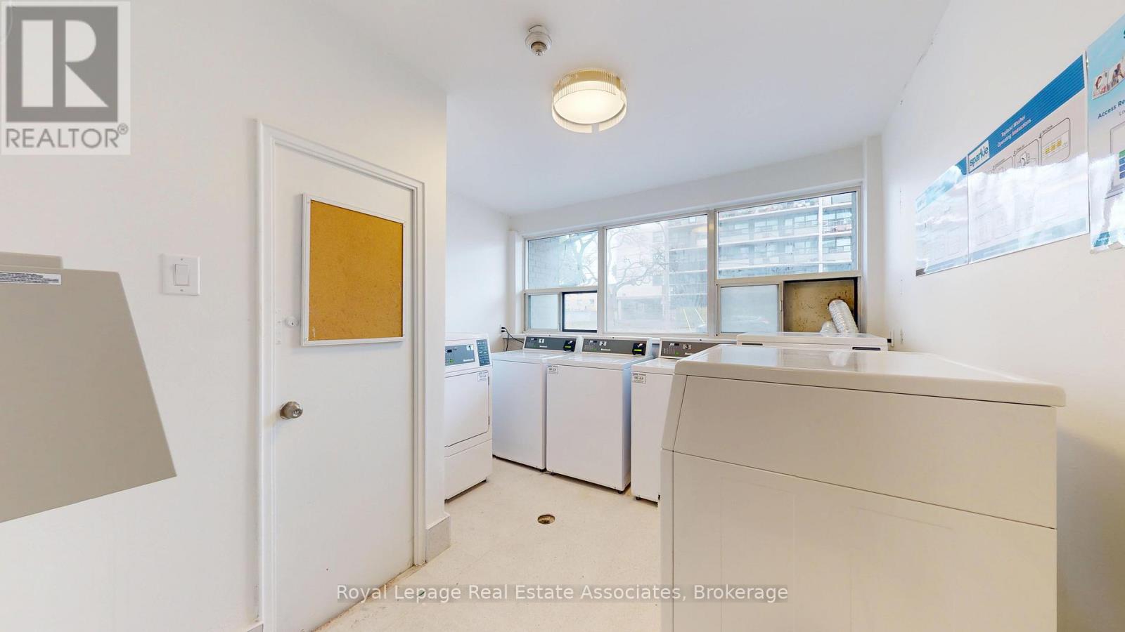 A white laundry room with a washer and dryer.