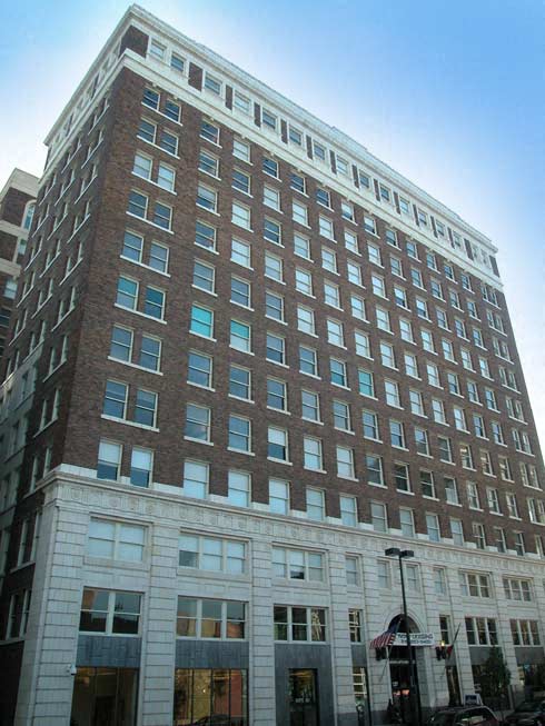 a tall building with a street in front of it