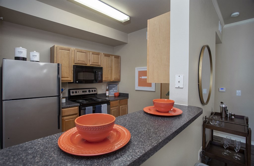 a kitchen with a counter top with two bowls on it
