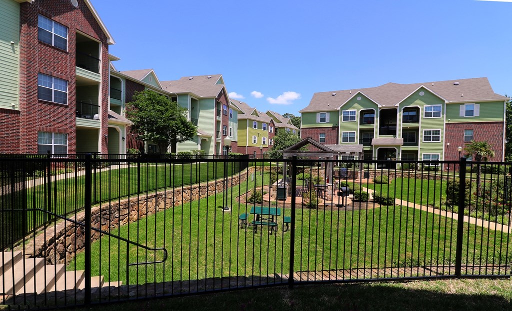 the view of our yard with our apartments in the background