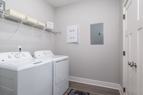 A laundry room with a washer and dryer.