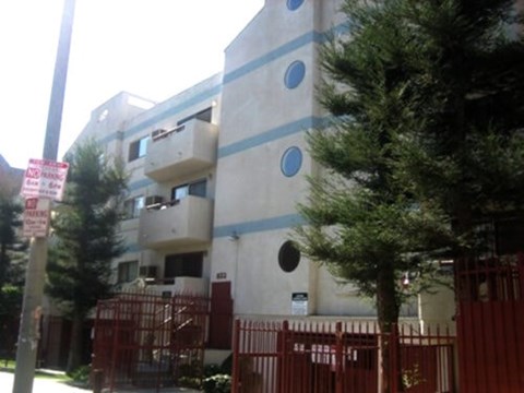 A building with a red gate in front of it.