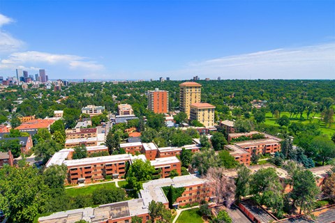 an aerial view of a city with buildings and trees