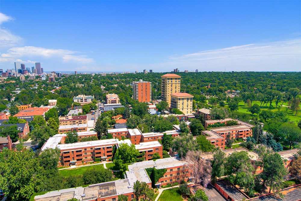an aerial view of a city with buildings and trees