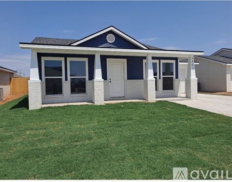 A small house with a white front yard.