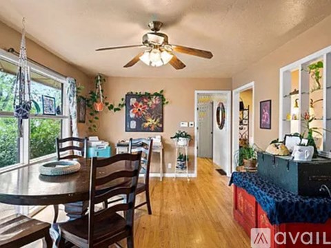 A dining room with a table and chairs is available for rent.