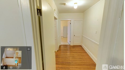 A long hallway with a door at the end.