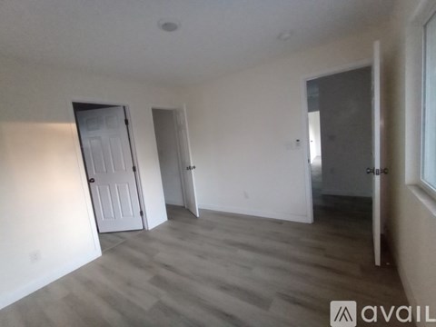 A room with a fireplace and a TV stand.