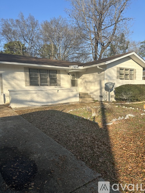 A house with a driveway in front of it.