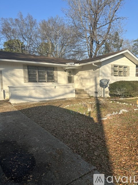 A house with a driveway in front of it.