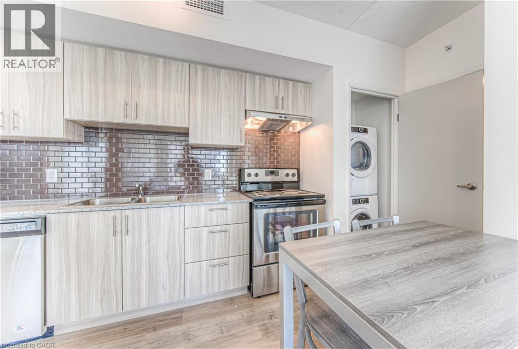 A modern kitchen with wooden cabinets and a washing machine.