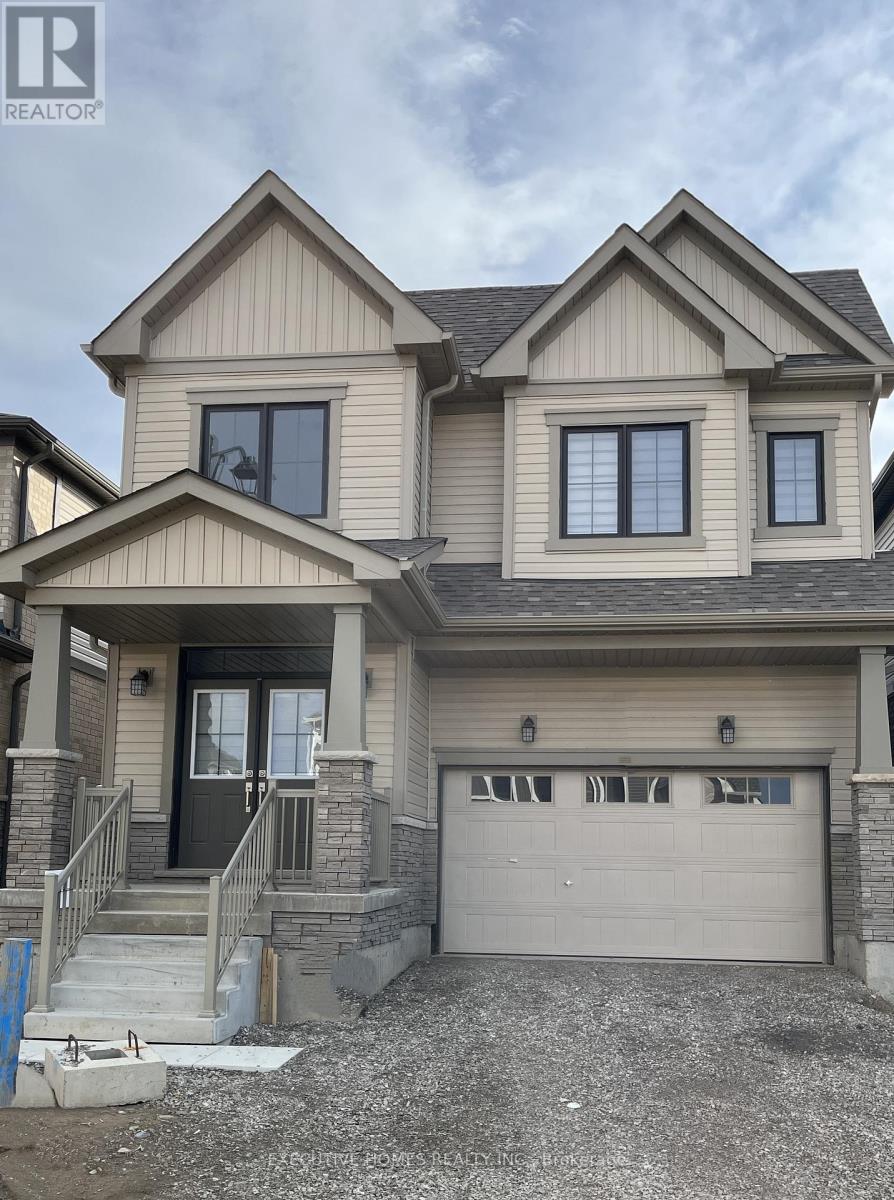 A two-story house with a garage is for sale.