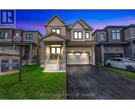 A two-story house with a garage is for sale.