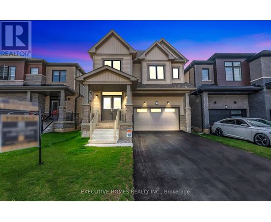 A two-story house with a garage is for sale.