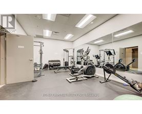 A gym with a variety of equipment including a rowing machine.
