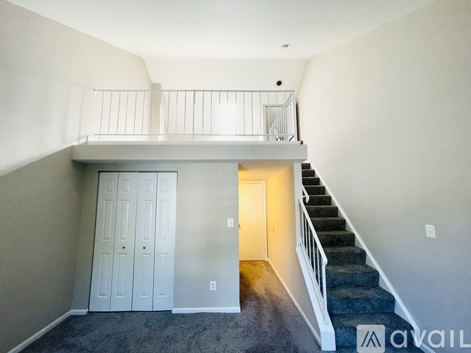 A room with a staircase leading to the second floor.