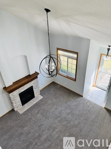 A bedroom with a bed, dresser, and mirror.