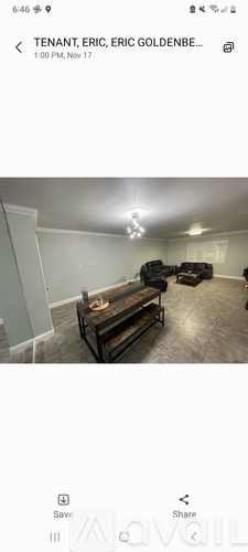 A room with a wooden table and chairs.