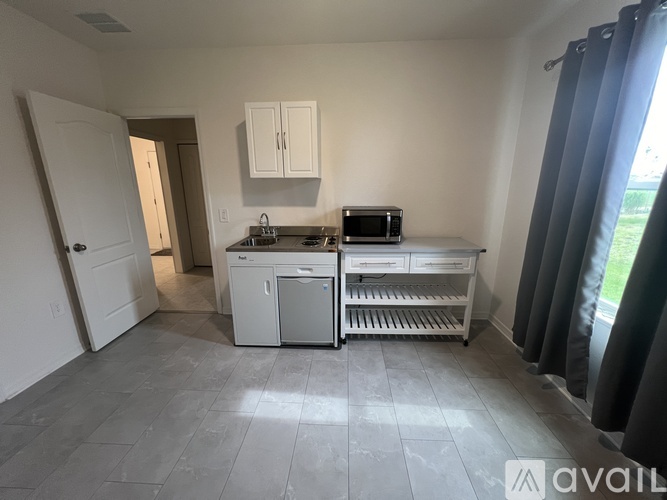 A kitchen with a microwave, oven, and dishwasher.
