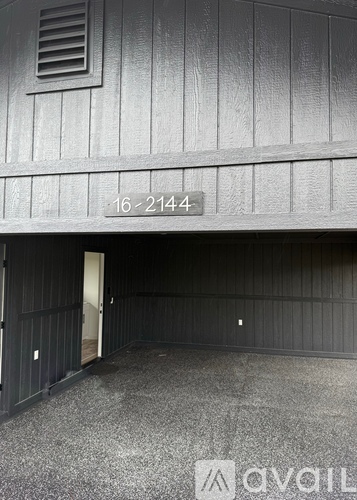A grey building with the number 16-2144 on it.