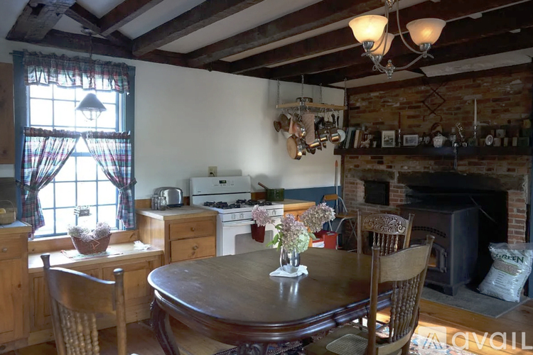 A cozy kitchen with a wooden table and chairs.