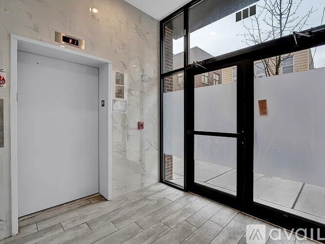 A glass door with a white door on the other side.
