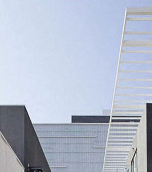 a view of the outside of a building with a long walkway