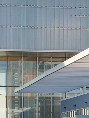 a man standing on a balcony of a building