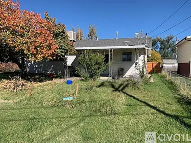 A house with a tree in front of it.