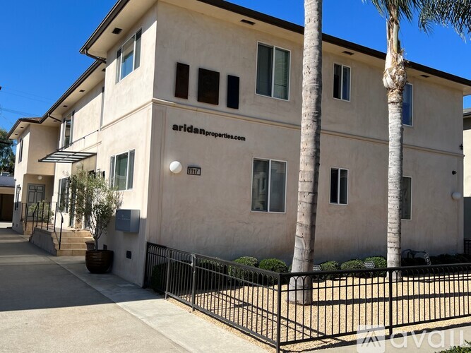 A building with the words "aridanproperties" on the side.