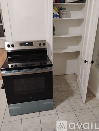 A white oven with a glass door is in a kitchen.