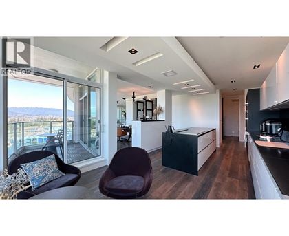A modern kitchen with a view of the mountains.