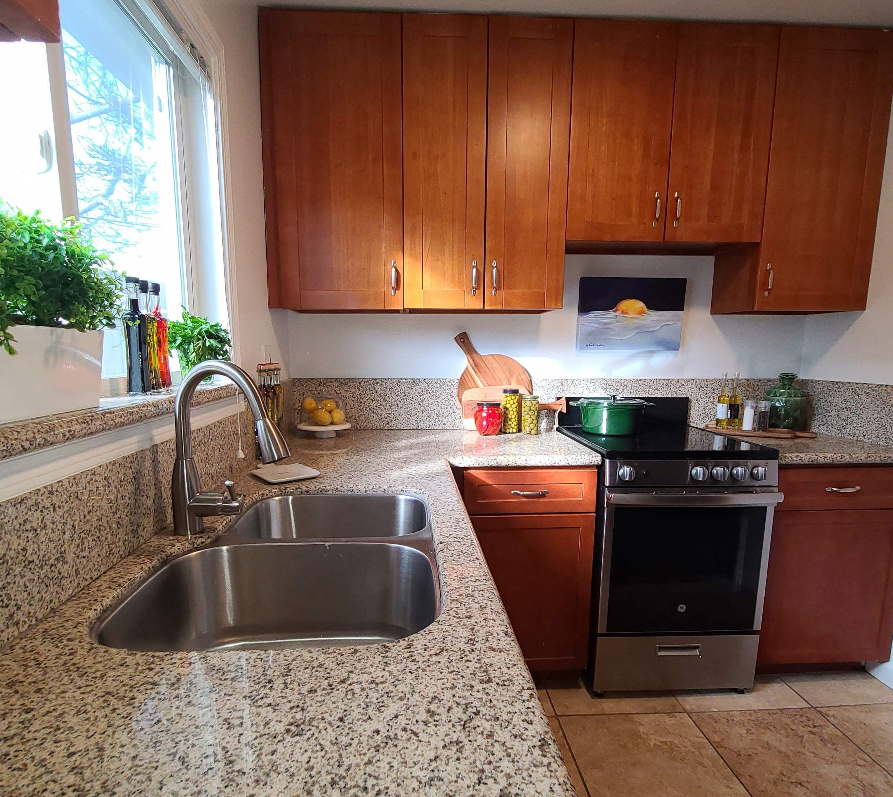 a kitchen with granite counter tops and a sink