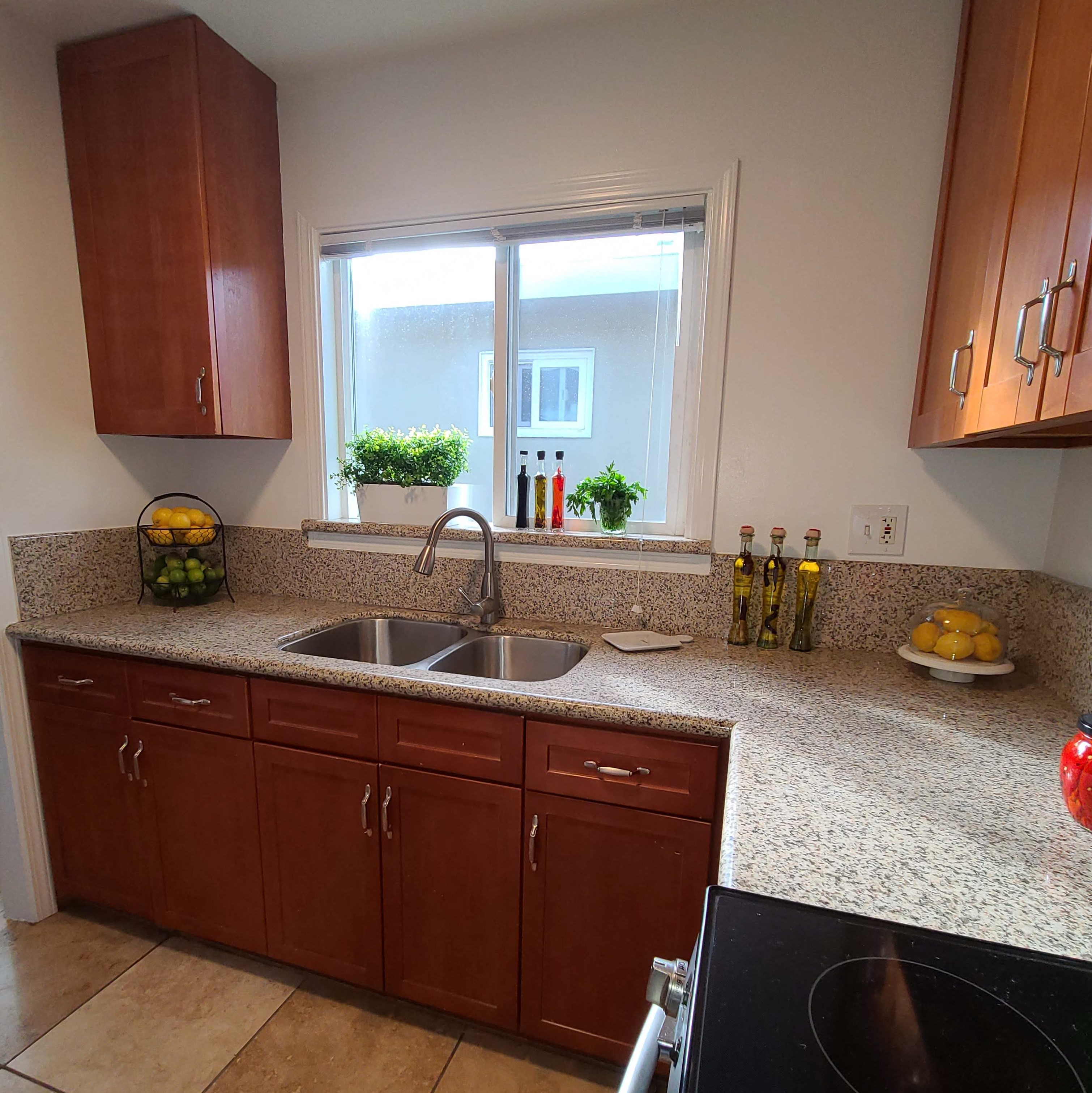 a kitchen with a sink and a window