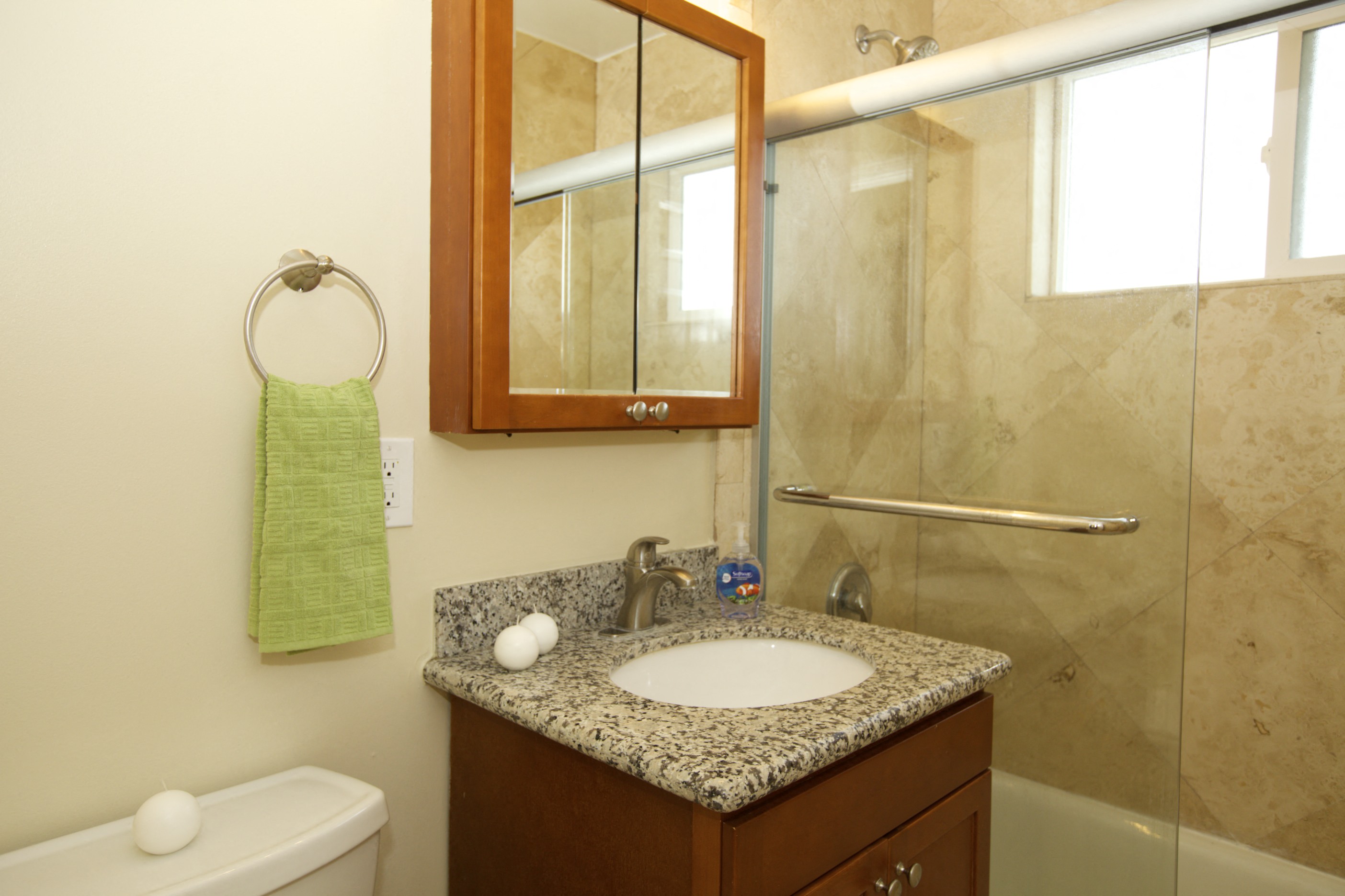 a small bathroom with a sink and a shower