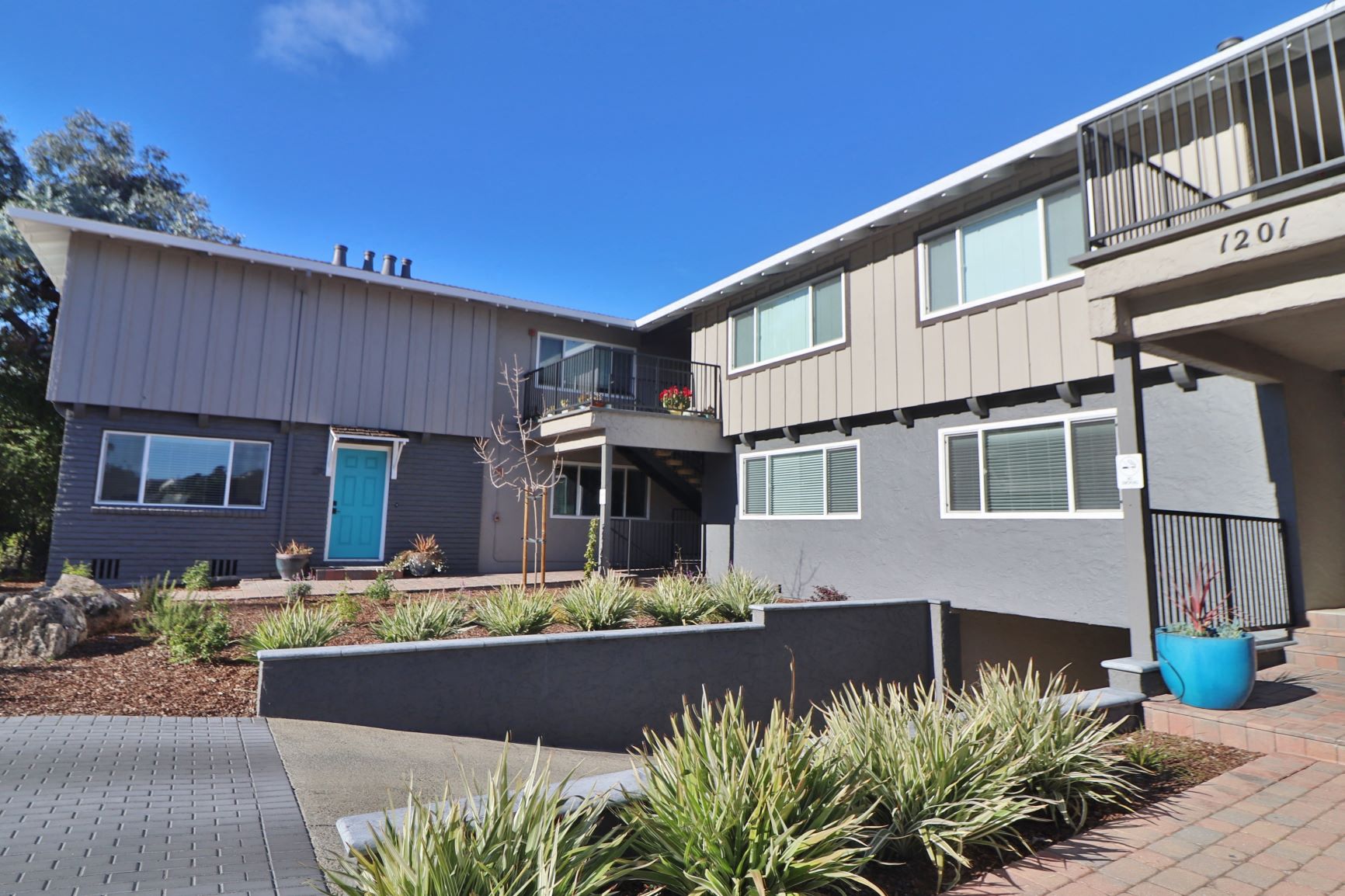 the front of a house with a blue sky