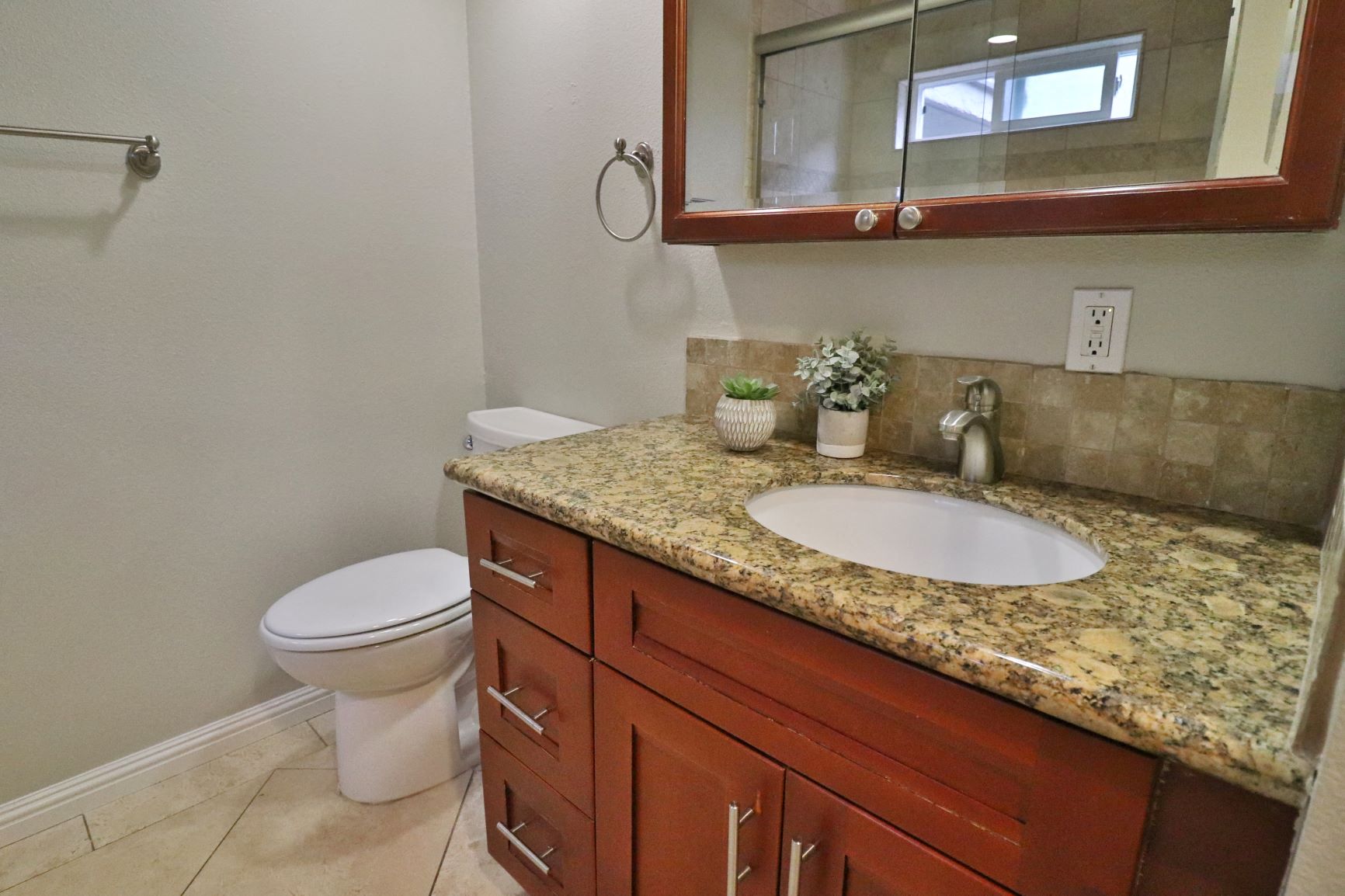 a bathroom with a sink and a toilet