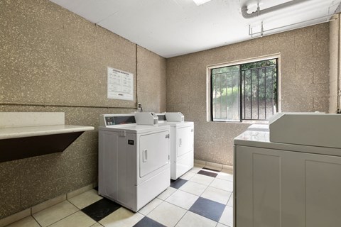 Apartments for Rent in Sherman Oaks, CA- Brody Terrace- Communal Laundry Room Washer and Dryer Units with Tile Floors and Spacious Window