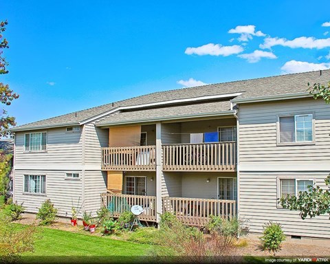 an apartment building with a porch and balconies
