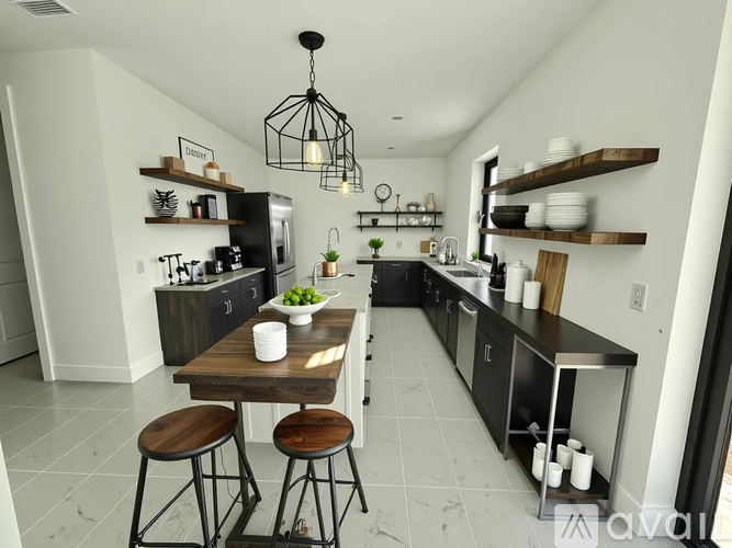 A kitchen with a table and chairs in the middle of it.