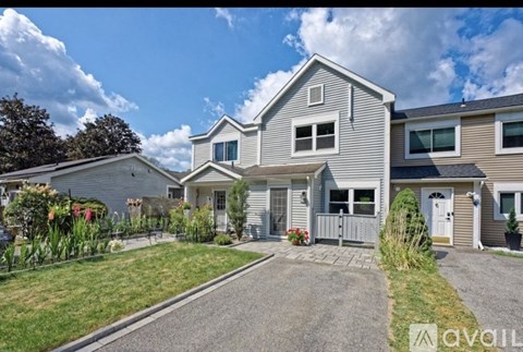 A house with a driveway in front of it.