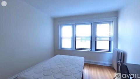 A room with a bed and a window.