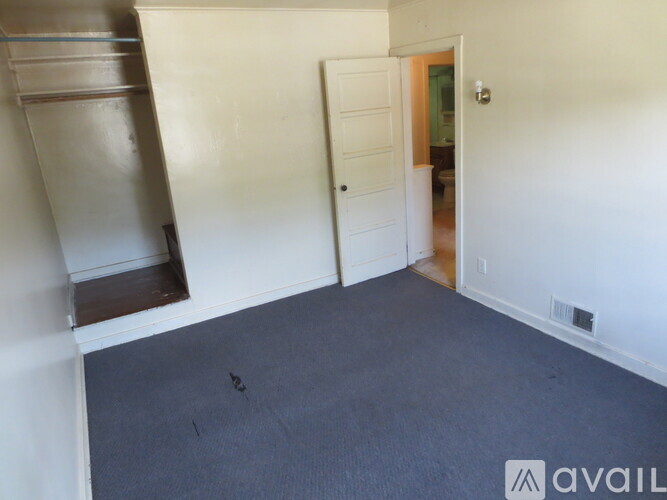 A room with a door and a window.
