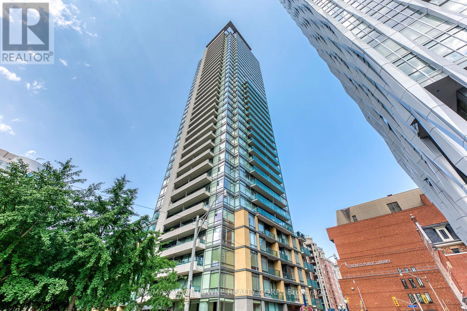 A tall building with a blue sky in the background.